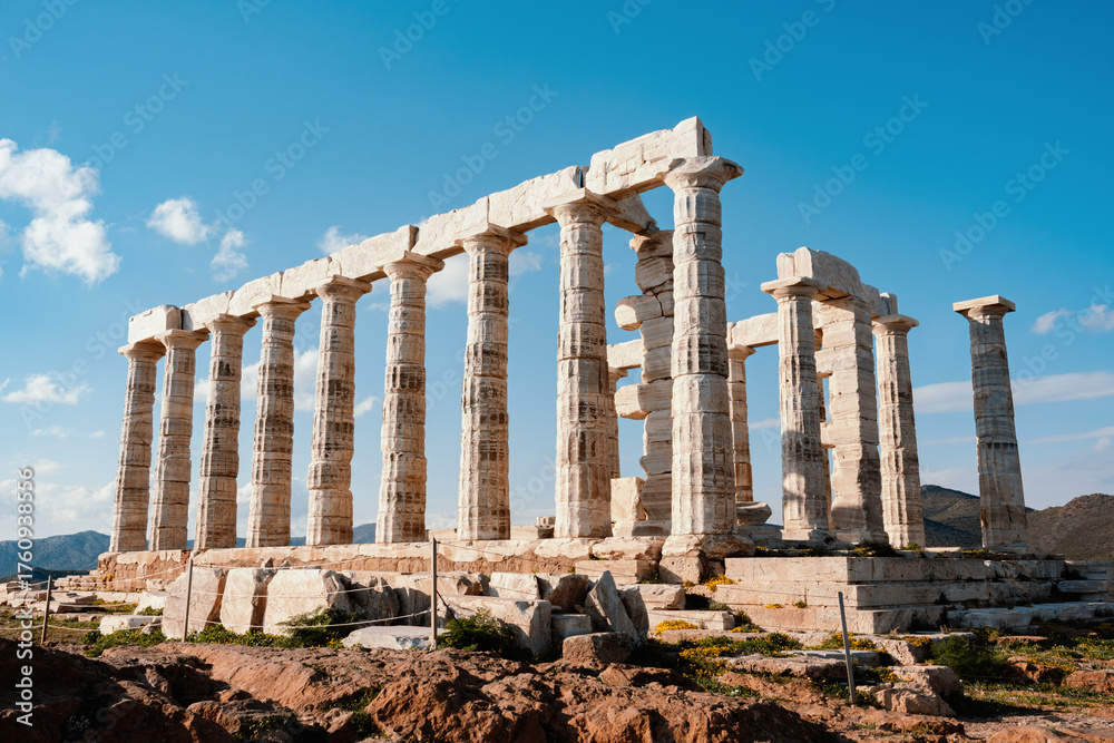 Fototapeta premium Temple Of Poseidon At Cape Sounion Under Blue Sky