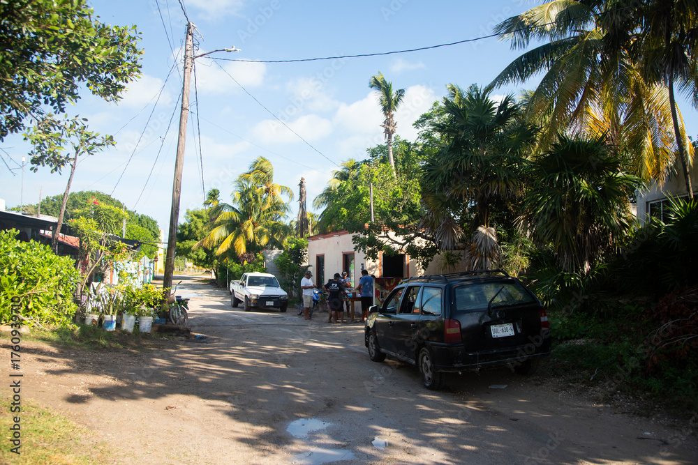 Obraz premium El Cuyo, Mexico; December 1st 2024: Streets and rural summer and tropical atmosphere of a fishing village on Mexico's Yucatan Peninsula.