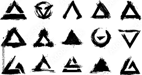 Set of abstract triangle symbols in brush ink style. Geometric black shapes with grunge texture in a vector illustration set.