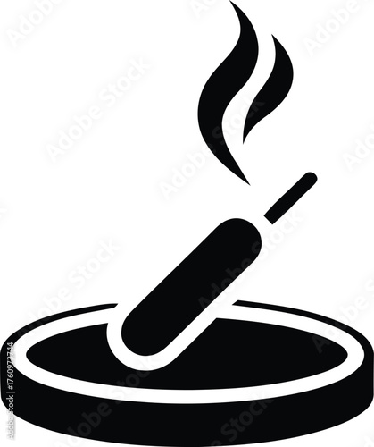 A solitary burning incense stick emits fragrant smoke from a circular holder symbolizing relaxation, meditation, and spiritual practices