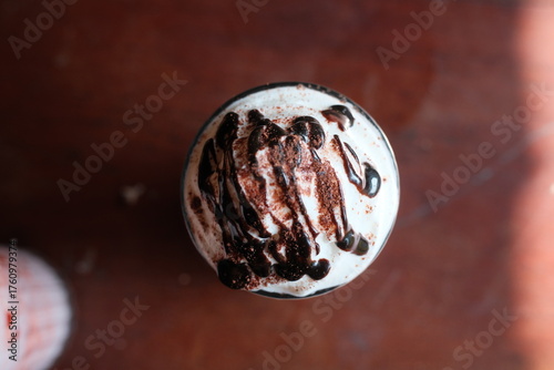 Photography Indulge in a decadent mocha delight, a sweet escape in every sip, topped with ri