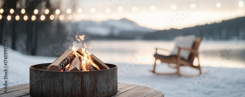 Cozy winter firepit gathering with christmas lights by snowy lake serene evening outdoor vibes