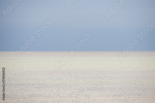 Minimal Seascape with Calm Waters and Soft Blue Sky in Northern Zealand, Denmark