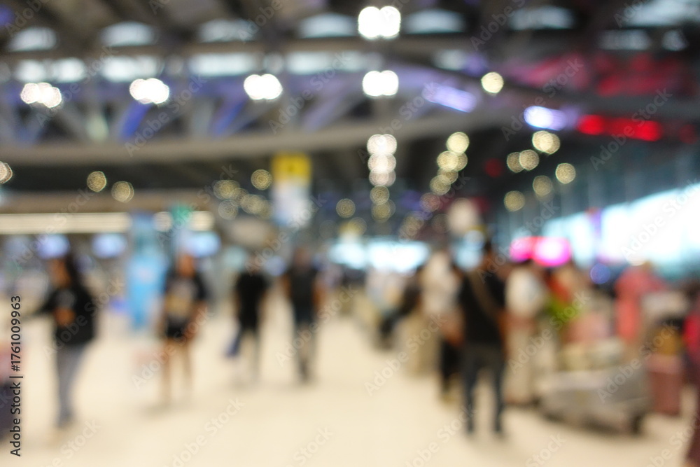 custom made wallpaper toronto digitalBlurred view of passengers and people at  International Airport. Travelers walking and checking flight information boards in the terminal. Busy atmosphere of people with luggage, lights, and airport.