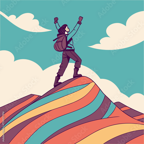 Hiker celebrates reaching the summit of a colorful mountain peak