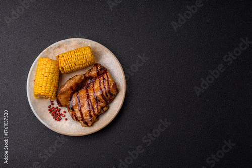 Grilled boneless chicken legs baked on the barbecue for lunch. Grilled chicken as a background