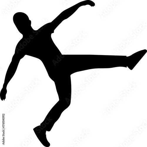 Silhouette of a soccer player kicking the ball, symbolizing strength