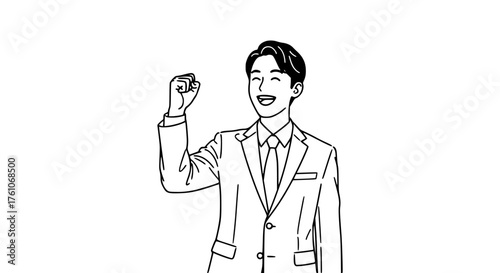 Excited businessman raising his fist in celebration of success