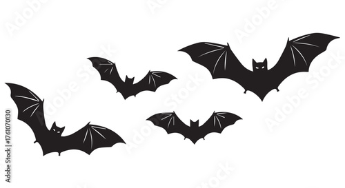 Four black bats flying in silhouette isolated on transparent background