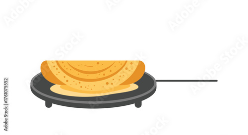 Crispy Golden Dosa Folded on a Black Griddle.