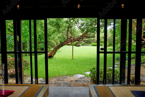 Traditional Japanese house home or ryokan restaurant with sliding paper shoji doors and view natural garden,restaurant or hotel interior.