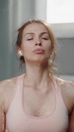 Woman practicing deep breathing with closed eyes