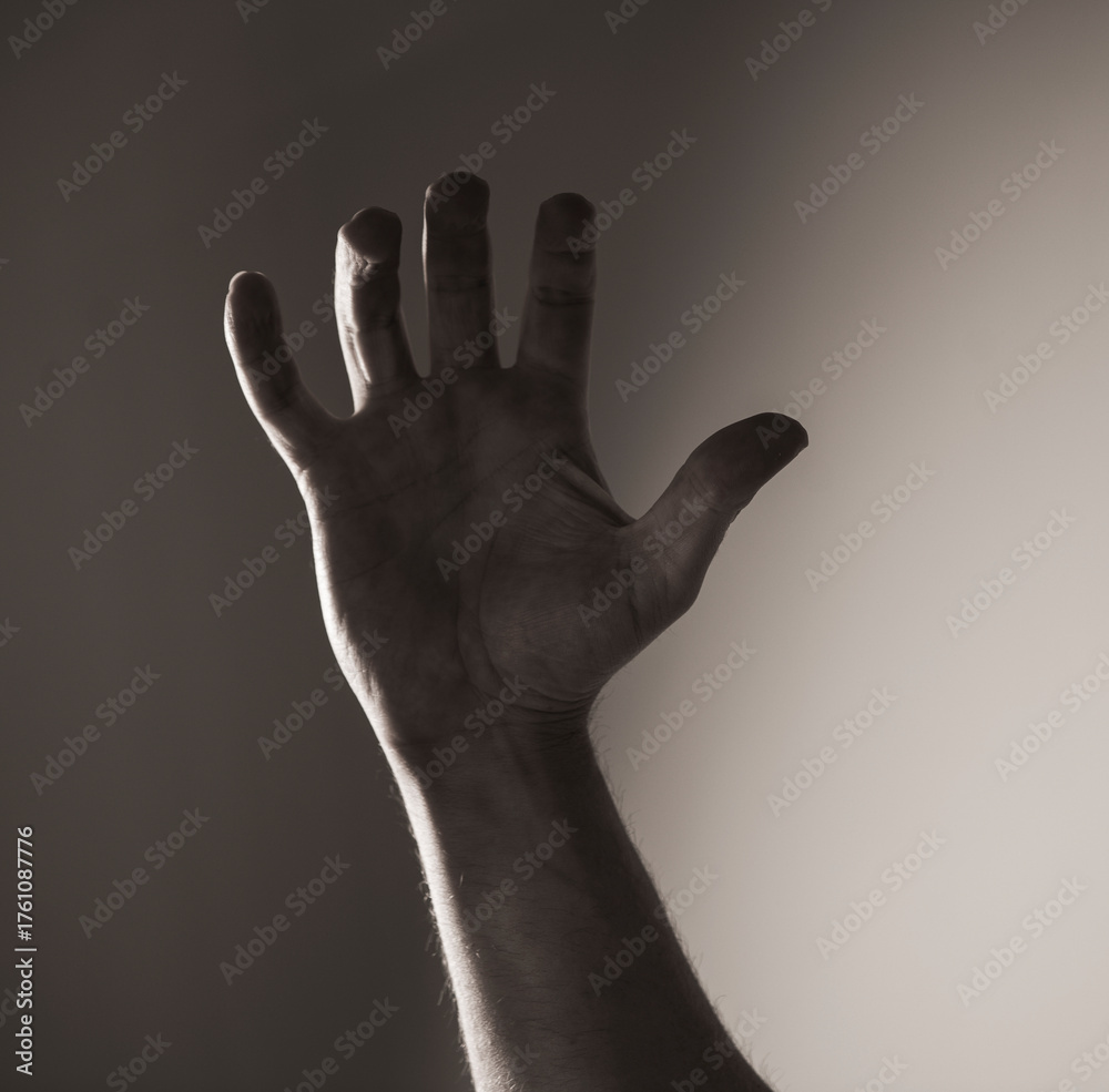 Fototapeta premium hand on black background. Hands concept. Help. Stress