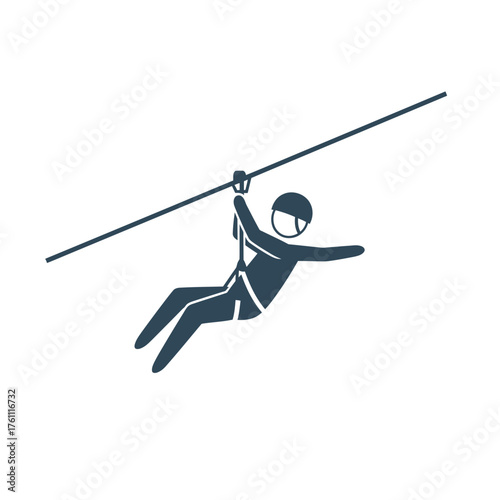 Person ziplining on a wire with harness and helmet.