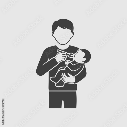 Man feeding a baby with a bottle.