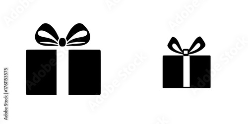 Gift boxes with bows displayed in contrasting sizes against a simple background