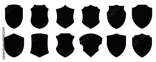 Set of black vector shield silhouettes, blank, customizable shapes perfect for creating heraldic emblems, vintage logos, medieval crests, and decorative design elements.