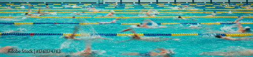 Fotografi Banner of Swimmers training in an indoor swimming pool, performing freestyle strokes in multiple lanes