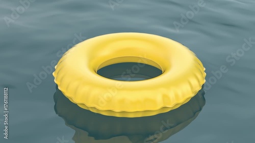 Yellow inflatable swim ring floating on water