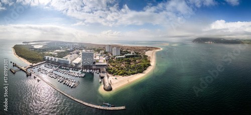 Stunning panorama of Troia Portugal showcasing the coast, marina, and lush landscape under a clear sky