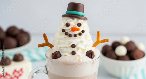 Festive snowman hot chocolate drink in a glass mug. A winter treat made with whipped cream, chocolate chips, and pretzel arms.