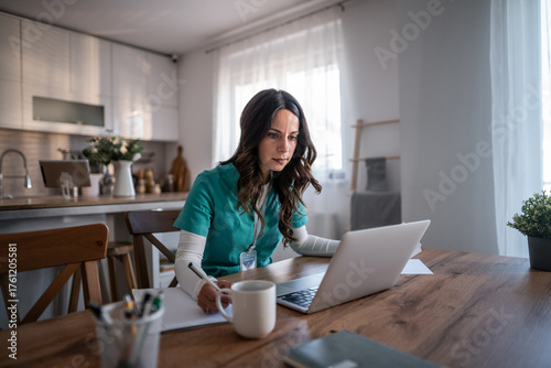 Healthcare professional working remotely from home studying