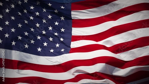 4k Slow Motion Seamless Looping Real American Flag Waving In Wind Against a Deep Blue Sky.