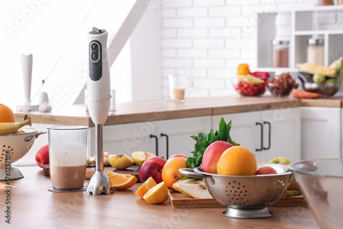 Fresh fruits and blender wi...