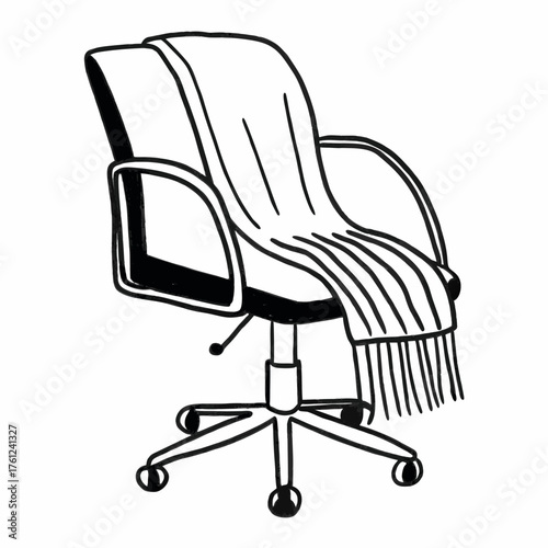 Office chair with cozy blanket draped over the backrest  
