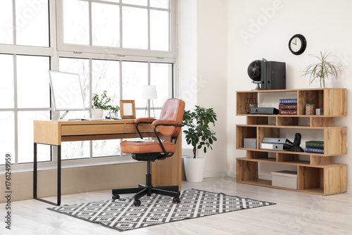 Brown swivel chair and work...
