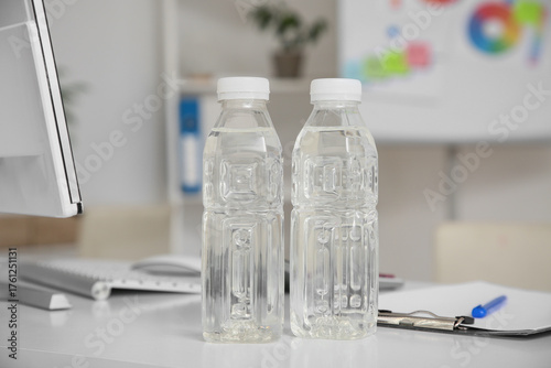 Plastic bottles of water on...
