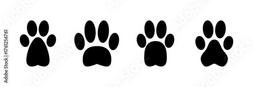 Paw icon vector illustration. paw print sign and symbol. dog or cat paw