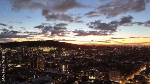 Wallpaper Mural Montreal skyline at dusk with glowing city lights and dramatic clouds over horizon. g. Torontodigital.ca