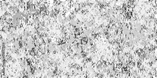 Abstract monochrome speckled texture background with irregular dark and light gray shapes