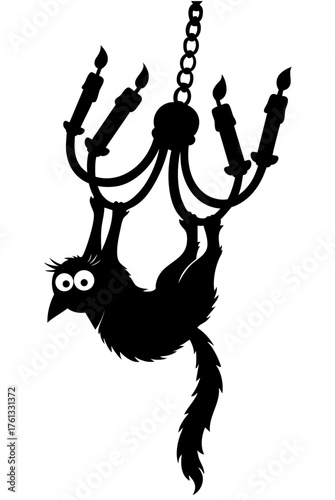 black cat hanging upside down from chandelier with burning candles