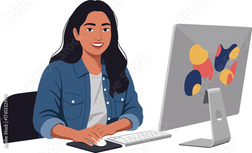 Creative woman working at a computer with colorful abstract art on the screen and engaging
