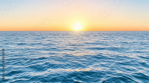 Sunrise over ocean waves creates serene atmosphere of infinite freedom and calmness