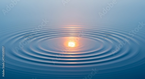 Water surface with gentle ripples reflecting light in concentric circles, calming and serene.
