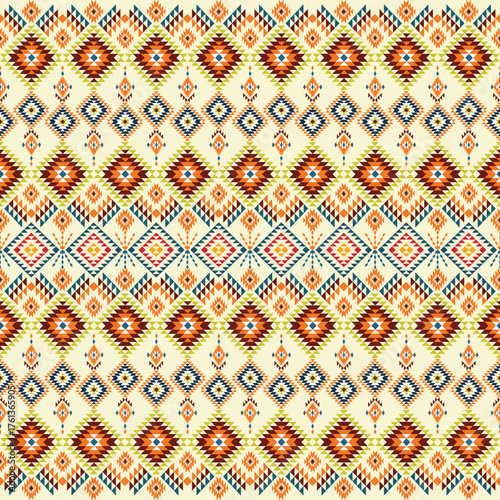 seamless geometric pattern. Warm-toned geometric pattern inspired by traditional tribal motifs, with orange and brown diamond shapes.