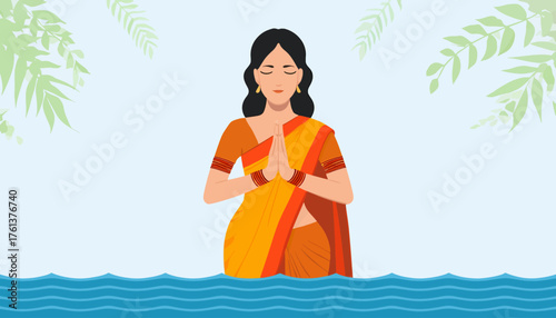 A woman in traditional attire stands in water with hands clasped in prayer, serene and peaceful.