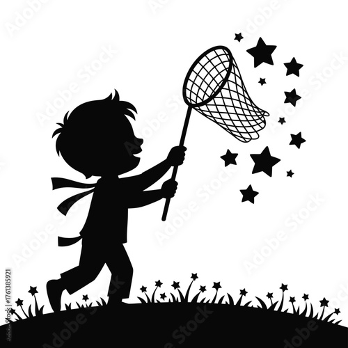 Boy catching stars with net on grassy hill silhouette
