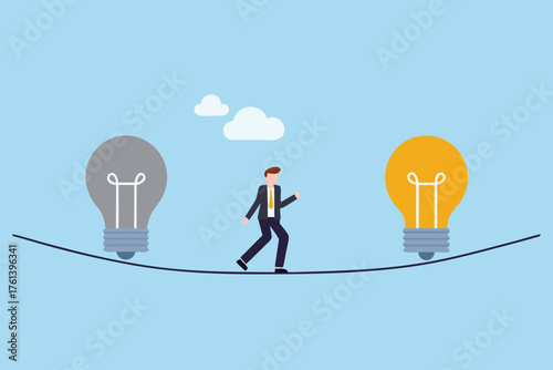 Businessman walking a tightrope between a gray and a bright yellow light bulb symbolizing ideas and innovation