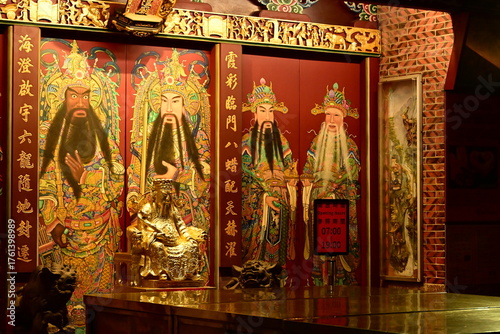 Taiwan - Oct. 11, 2025: Illuminated altar with deity statues at Taipei Xiahai City God Temple, Grade 3 historic monument on Dihua Street, renowned for matchmaking deity worship.