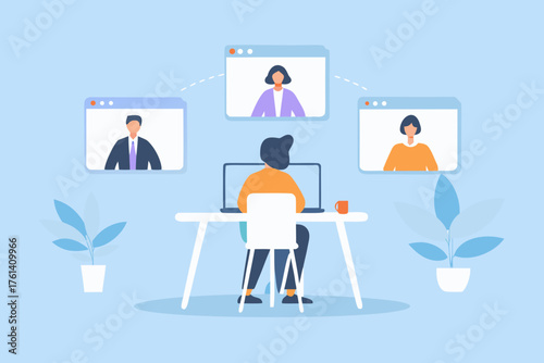 Person working remotely on a laptop participating in a video conference with colleagues