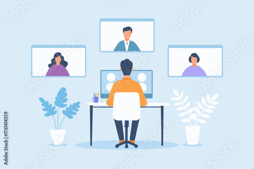 Man participating in a video conference call with colleagues from his home office setup