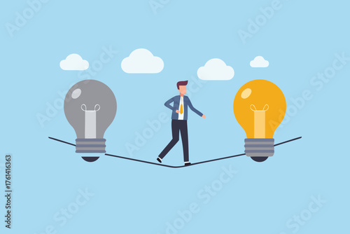 Businessman walking on a tightrope between a gray and a bright yellow light bulb symbol