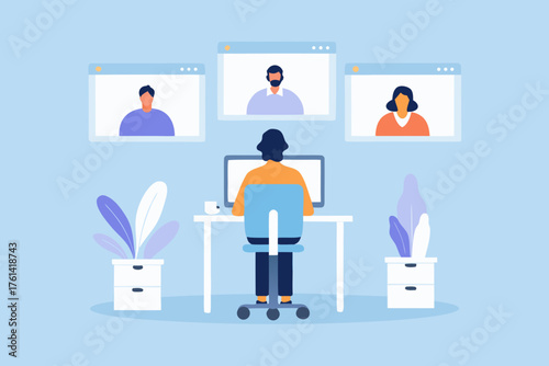 Person participating in a video conference call with colleagues from home office setting
