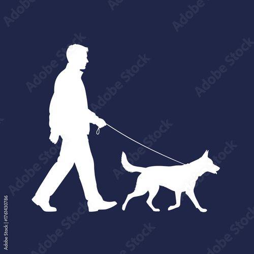 Man walking dog on leash in silhouette against dark background  