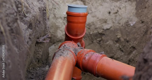 Wallpaper Mural Close-up of external sewer installation and pipes in a trench. Construction excavation work. Slow-motion video in 4K quality Torontodigital.ca