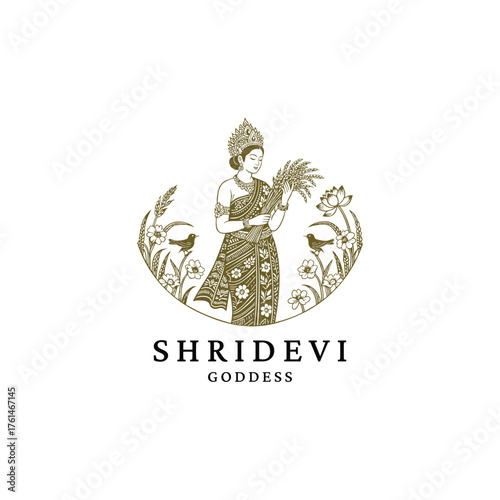 engraving logo featuring the Hindu Goddess Shridevi, the deity of harvest, fertility, and prosperity. She is depicted holding sheaves of ripe grain, surrounded by lotus flowers and birds